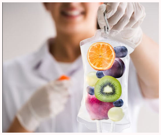 New Hope Vitality clinician holding a fruit-infused IV hydration bag