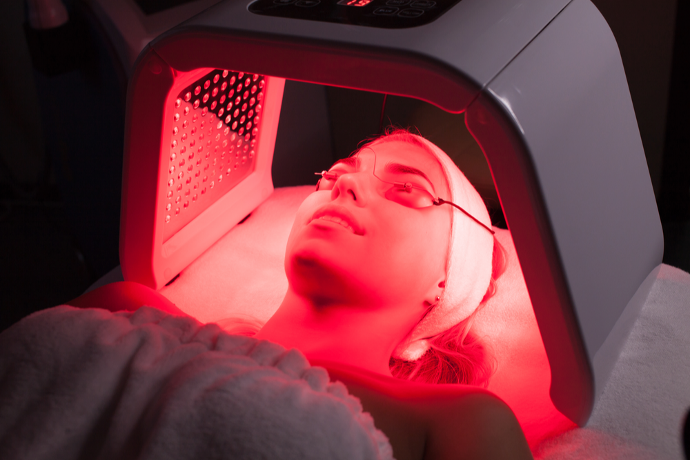 Client receiving a red light therapy facial session